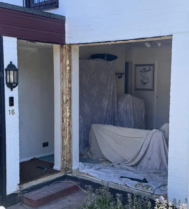 Front entrance opened up with dust sheets inside